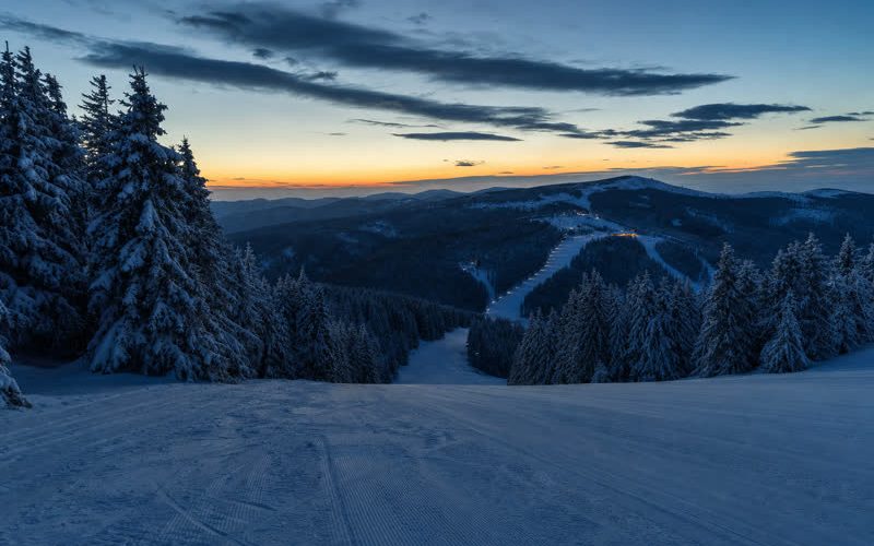 Snow-covered Kopaonik ski slopes in blue-hour light