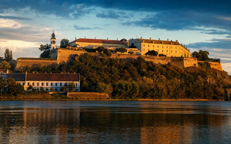 Petrovaradin fortress and Novi Sad on the Danube at golden hour